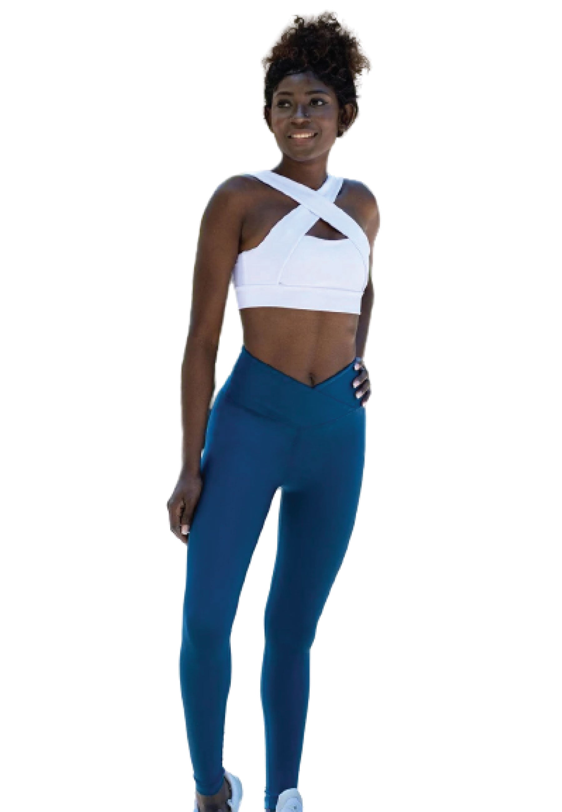 Person in Lisminas 1096 Ve Waist Leggings in Petrolblau und einem weißen Oberteil, lächelt vor einem weißen Hintergrund.